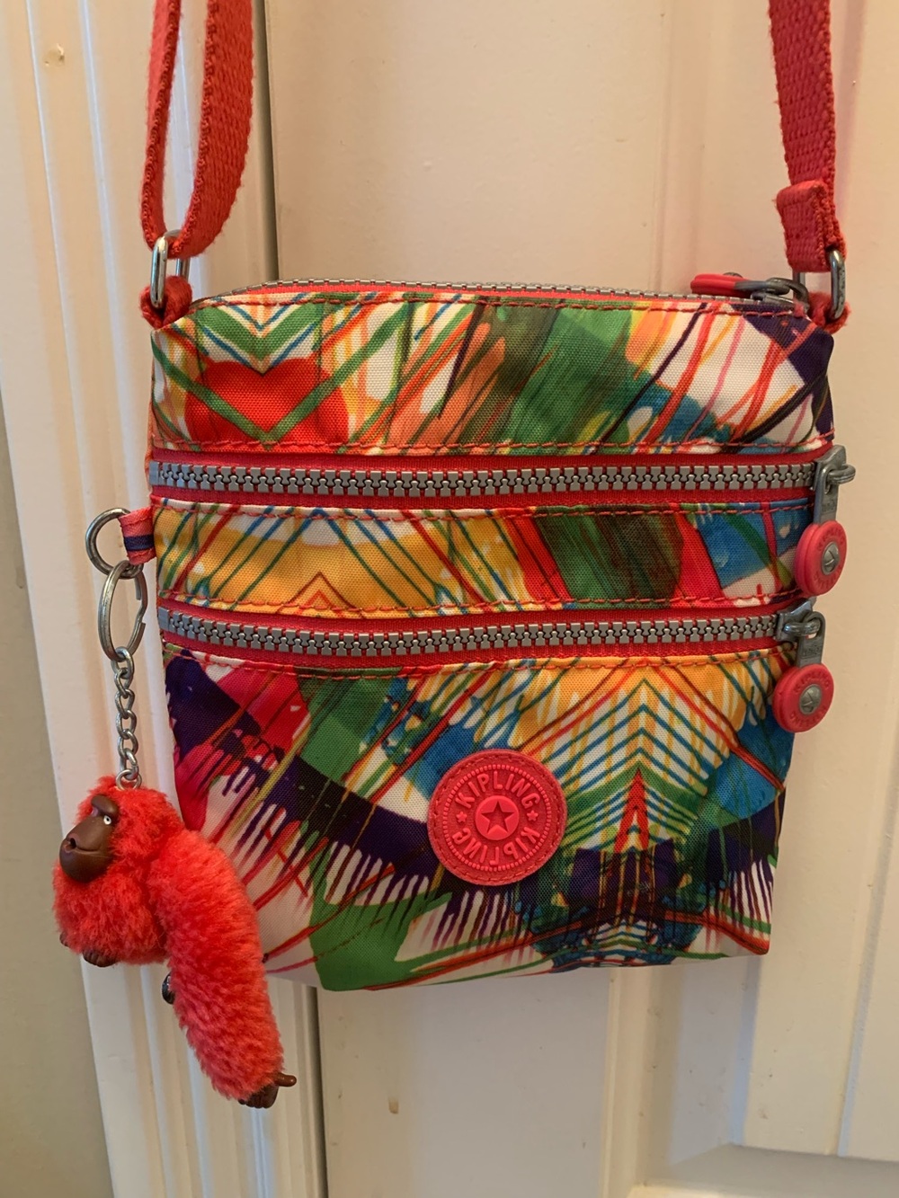 Kipling Multi-Color Geometric Print Crossbody with Coral Accent